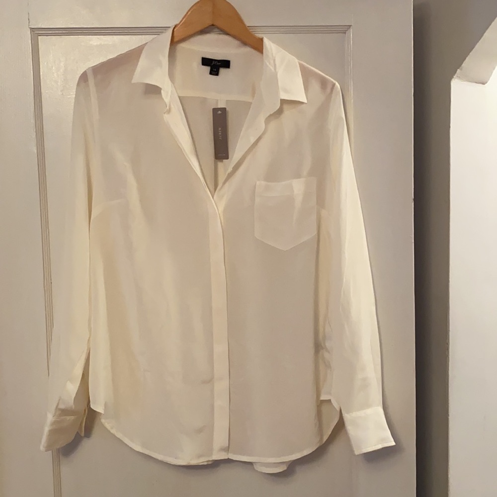 J. Crew ivory silk button-up blouse.